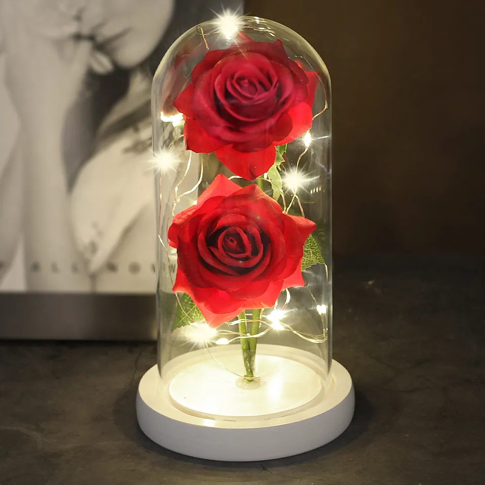 Two Roses In A Glass Dome On A Wooden Base