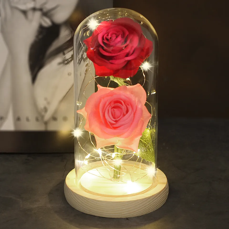 Two Roses In A Glass Dome On A Wooden Base